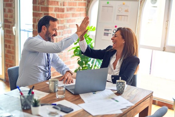 Team members celebrating their choice on their Employer of Record provider.