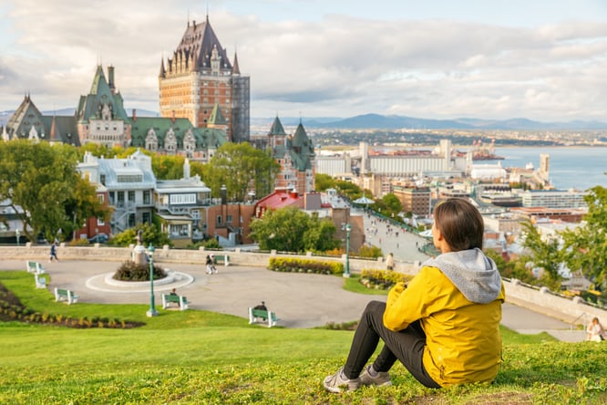 Woman overlooking a town in Canada.