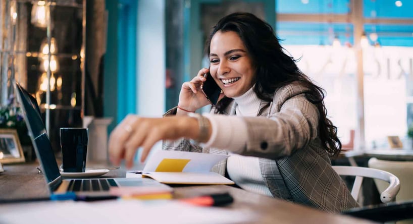 CEO speaking with a potential candidate remotely at a coffee shop.