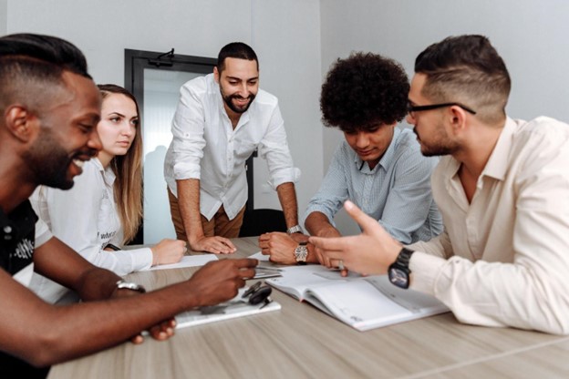 Business team discussing how an Employer of Record (EOR) provider can help them with their global workforce initiatives.